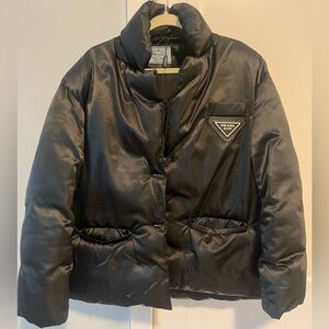 PRADA woman’s oversized button-up puffer jacket